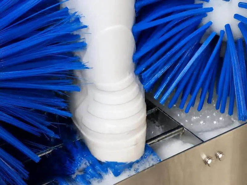 Boot washer machine with blue nylon roller brushes cleaning work boots